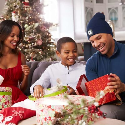 O Natal dos adolescentes das mulheres dos homens apresenta o chapéu dos fones de ouvido de Bluetooth com Headtorch