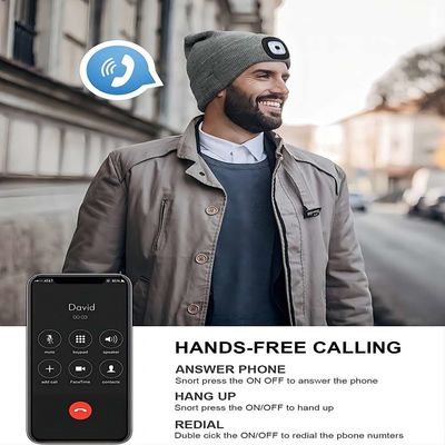 Chapéu ireless cinzento dos auriculares livre suas mãos aos Callings do telefone do playback da música